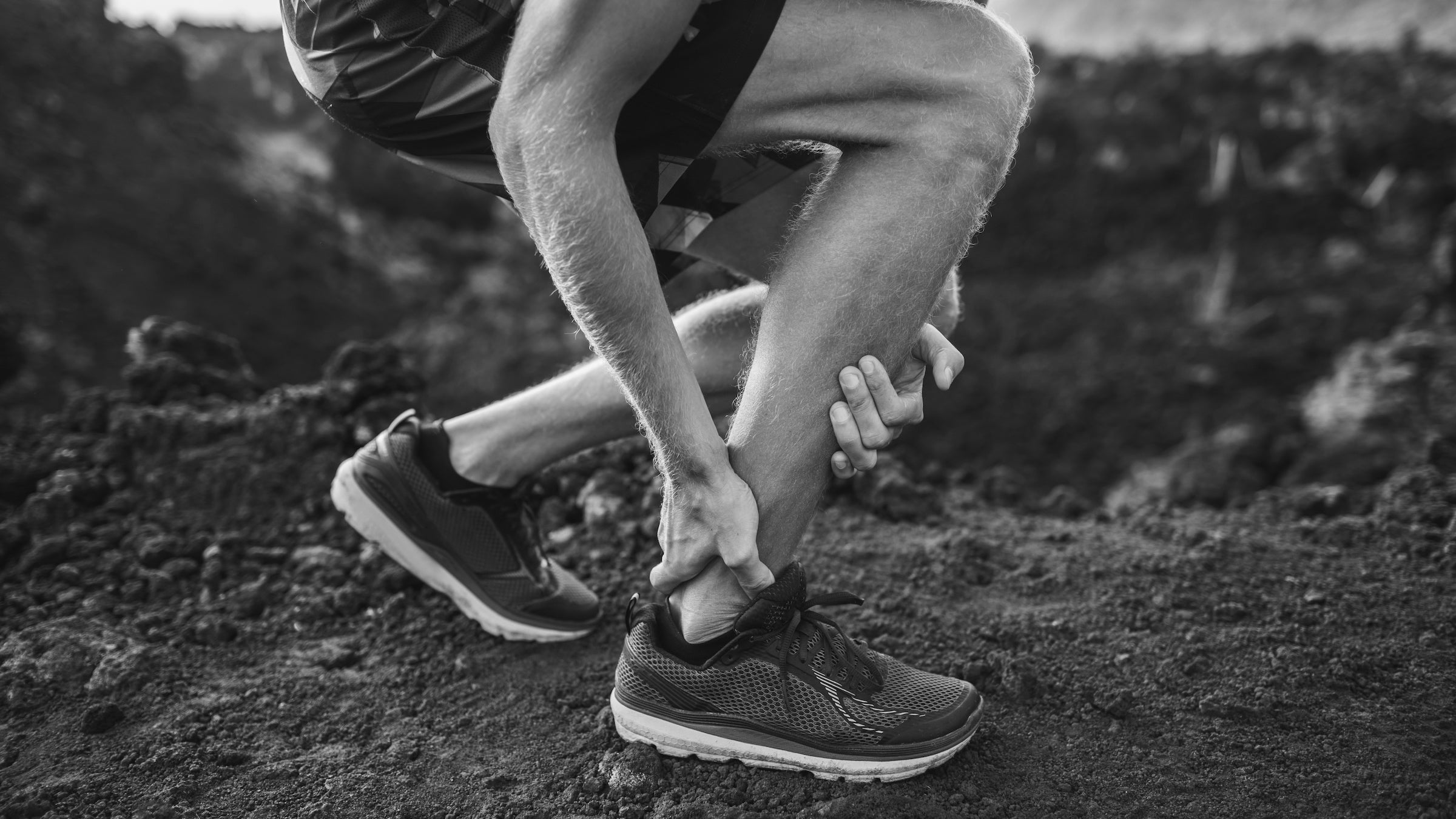 A runner holds his achilles heel