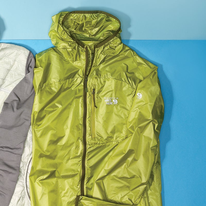 Best For: Speed freaks. The Test: Simply making a three-ounce-and-change hooded wind shell is an impressive feat. Doing that while incorporating this many features is remarkable. Stuffed into its own chest pocket, the Ghost Lite ($100) disappeared in our hydration pack or pocket. (There’s also a fabric loop so you can clip it onto your harness.) When we unfurled it on a blustery ridge, the DWR-coated fabric fended off both high winds and light rain. The real kicker is the hood: elastic binding makes for a snug fit, and it rolls and stows with a Velcro tab. The Verdict: There’s no reason to ever leave this shell behind. 3.1 oz; mountainhardwear.com Breathability: 2.5 Weatherproofness: 3.5
