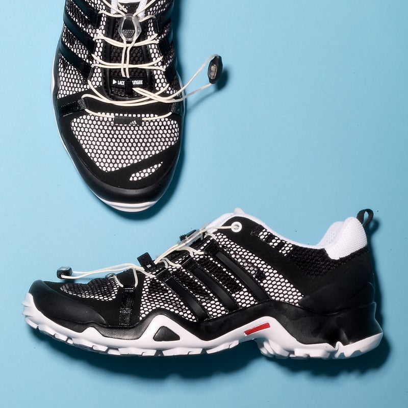 Best For: Stream crossings.
The Test: With lots of breezy mesh and a high-traction tread, the Breeze ($110) is somewhere between a hiking boot and a water shoe. It’s not an ideal hybrid—that airy upper can get gummed up on sandy trails—but the solid chassis and reinforced heel and toe cup held up well over jagged rocks. “With most mesh shoes, I’d be scared of ripping my feet to shreds on technical terrain,” said one tester. “But I felt totally comfortable.” When it’s used as a water shoe, the EVA tongue and molded liner are plenty comfy, and it dries fast.
The Verdict: A tough, low-cut hiker that’s happy wet. 11.5 oz; adidas.com
Comfort: 3.5
Traction: 5