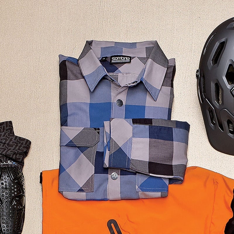 Though it looks and feels like our trusty old flannel top, this long-sleeve jersey ($99) is cut from a soft, breathable woven synthetic that moved with us on the bike and shrugged off errant branches. The underarm vents dump heat nicely, while the hidden side pockets hold all the essentials. sombriocartel.com