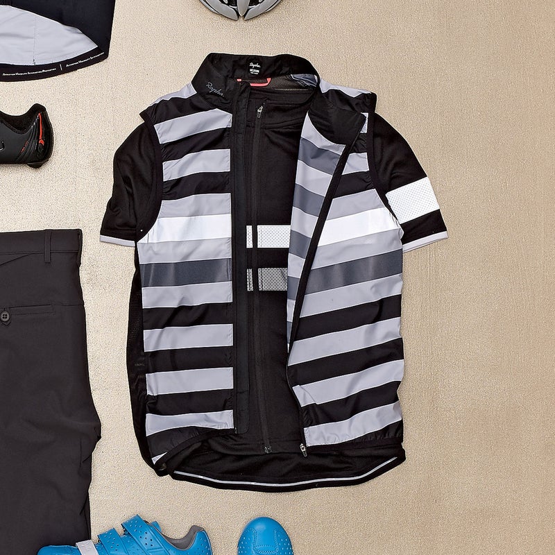 The stylish merino-poly jersey ($265) is built for long days, with five pockets and reflective stripes; the vest bumps up visibility even more. rapha.cc