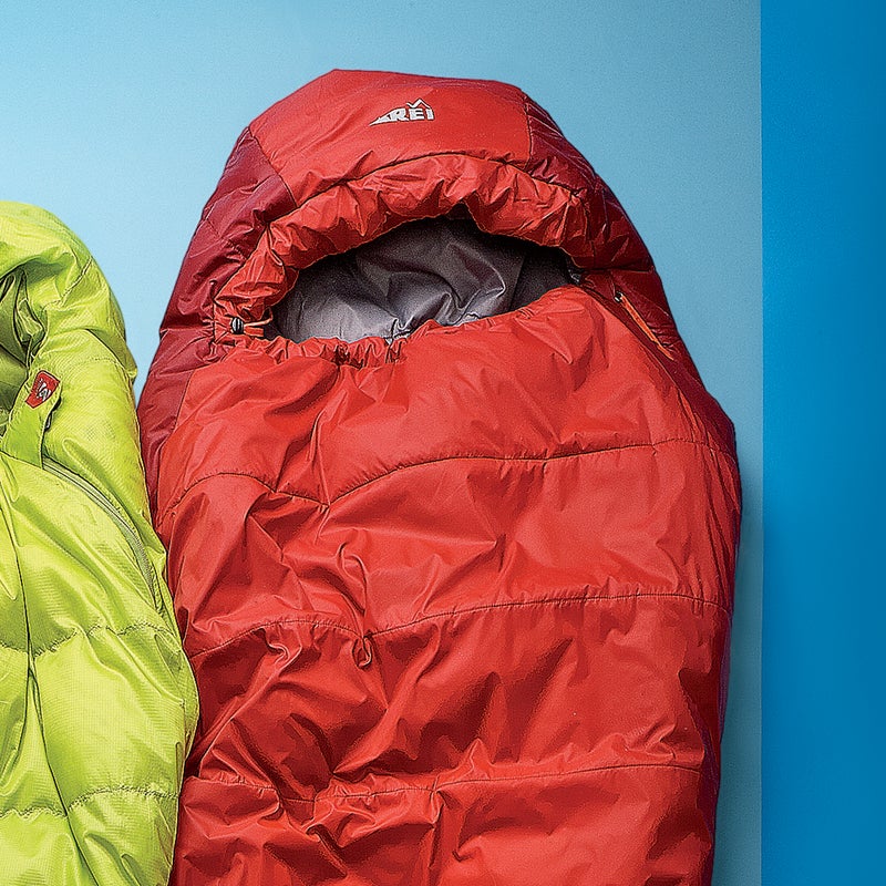 Best For: Stretching your dollars.
The Test: Like the other synthetic bags here, the Lumen ($159) offers a lot of bang for the buck. For $159 you get a contoured foot-box, a face muffler, a full-length zipper, and zipper guards to prevent snags, just to name a few features. Inside, overlapping sheets of synthetic fill lock in warmth, and the mix of hollow and micro-denier fibers boasts an excellent warmth-to-weight ratio: the Lumen weighs the same as the half-down, half-synthetic Marmot but is several degrees warmer and more compressible than the all-synthetic Rab.
The Verdict: The closest to down we’ve seen. 20°; 2.5 lbs; rei.com
Sleep Comfort: 4
Warmth to Weight: 4