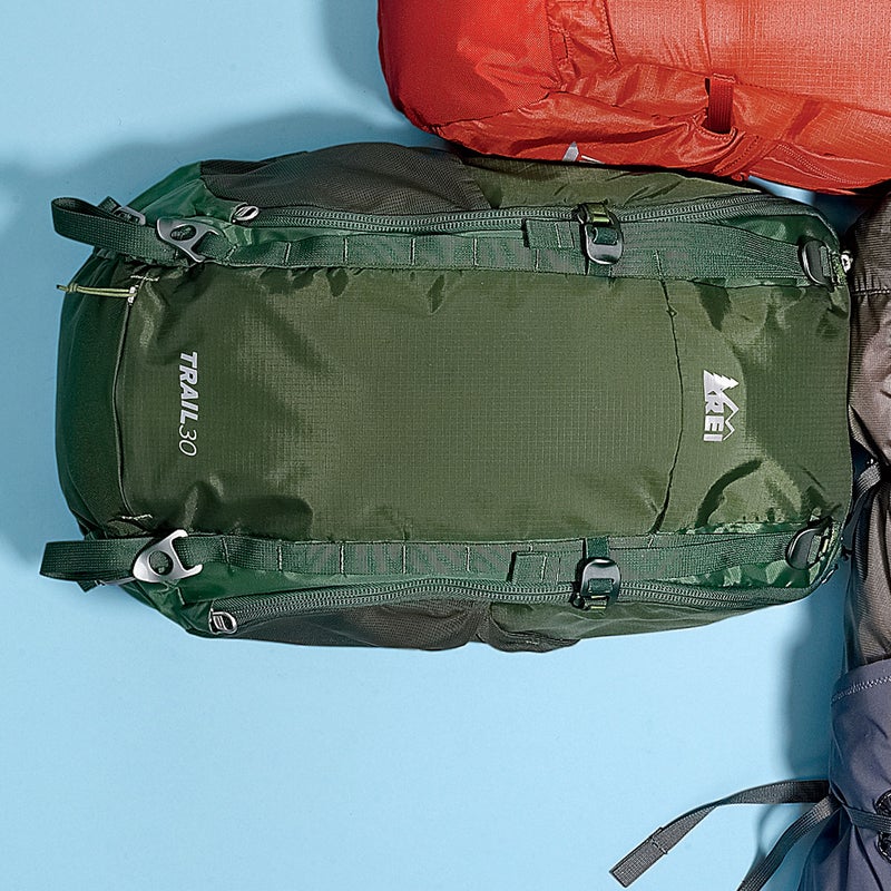 Best For: Long day hikes; the highly organized. The Test: With a light steel frame, built-in rain cover, and thickly padded hipbelt, the Trail ($100) is the most feature-laden daypack here. Plus, unlike most packs this size, it zips all the way open for easy access to buried stuff. “It’s like REI simply shrank one of its big multi-day packs,” remarked one tester. Highly organized hikers will be in heaven, thanks to smartly crafted trekking-pole attachment points and four side pockets (three stretchy and one zippered), which make it easy to keep track of snacks, maps, a water bottle, and gadgets. The Verdict: Great price for a daypack with all the fixins. 2.4 lbs; rei.comComfort: 3.5Versatility: 4