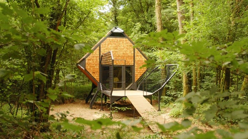 The diamond-shaped cabin on legs can be moved around the forest without harming or disturbing local ecosystems. Acacia wood, Douglas pines, and galvanized steel blend into the landscape, camouflaging the diamond-shaped form in the shadows of the undergrowth. Capable of housing up to four people, the structure’s minimal amenities allow for a pared-down and invigorating outdoor experience.