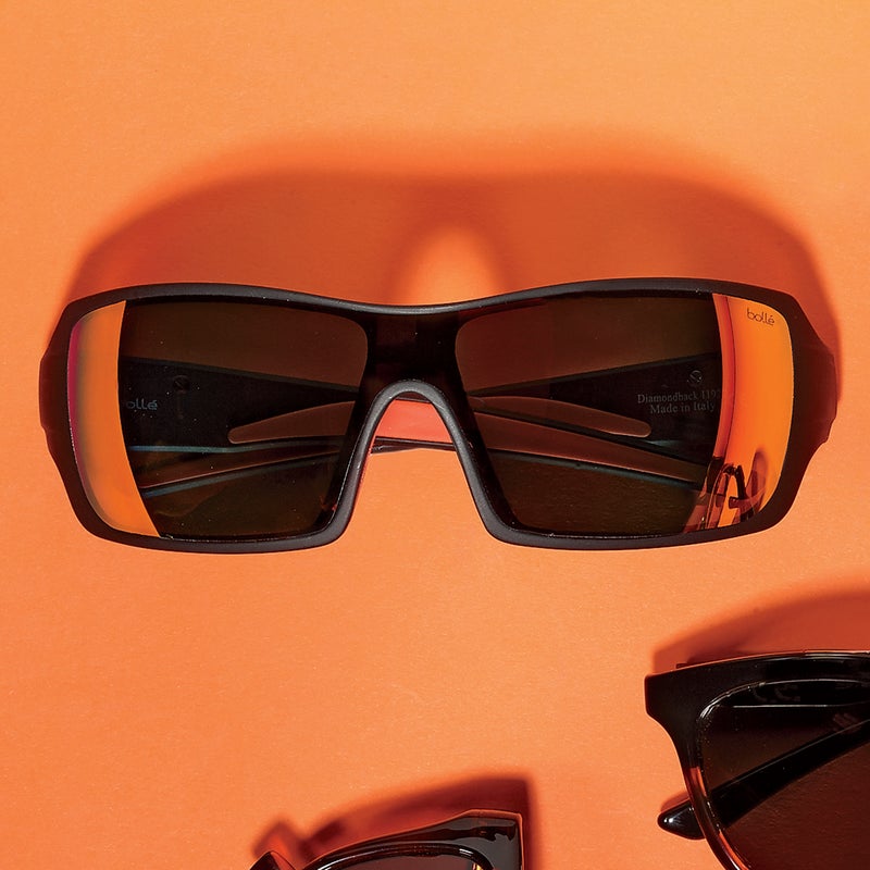 Best For: Catching rays at the Mandalay Bay wave pool.
The Test: Alien robot eyes of fire are what these shamelessly loud shades give the wearer. The mirroring creates a blaze of color, a sort of hellish rainbow. With its wide single-blade lens, the Diamondback ($110) riffs on ultra-serious sports shields without actually joining the club. The gray, nonpolarized-polycarbonate glass is easy on the eyes but makes for a flat view. Still, this is high-quality knock-around eyewear.
The Verdict: Not for the shy or self-serious. bolle.com
Style: 4
Versatility: 2