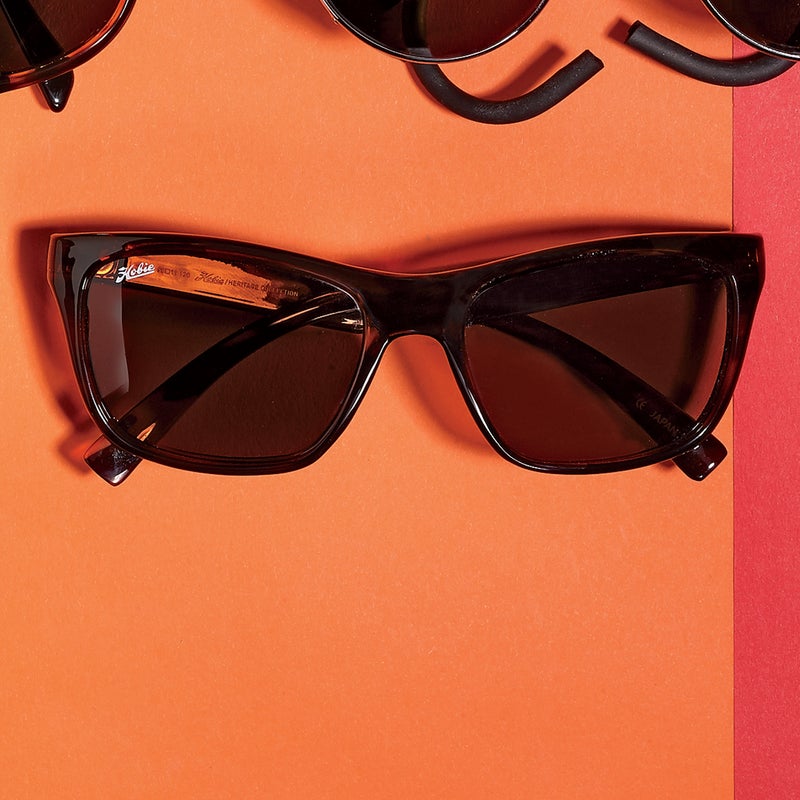 Best For: Power lunches.
The Test: Nowadays it looks businesslike, but the original Woody was created by the late Hobart “Hobie” Alter for Southern California lifeguards. The update ($140) does retro gracefully. Lenses are polarized glass in a copper tint that diffuses noon rays. You’ll want to avoid outdoor sports (glass shatters), and the flattish lenses let in too much light for the original purpose. Instead, consider the Woody great everyday shades.
The Verdict: Premium sunglasses with quiet style. hobiepolarized.com
Style: 4.5
Versatility: 3.5
