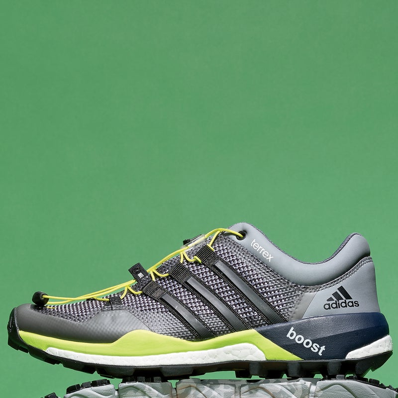 Best For: Hammering technical trails.
The Test: This shoe ($160) is a screamer in challenging terrain—quick on the turnover, extremely confident on fast corners, and dependable in chunky turf. The thin layer of foam in the midsole offers the perfect balance of sharp-rock smothering and a responsive, close-to-the-ground feel. The big, broad lugs bit well in muck and gravel but didn’t feel gummy or slick on flat granite. Wide-footed runners might chafe at the overlays, which wrap directly over the metatarsal bones, while those with narrow feet will be cranking hard on the laces.
The Verdict: It’d be Gear of the Year if not for the slightest slippage on downhills. 10.2 oz; 6 mm drop; adidas.com
Speed: 4.5
Protection: 4.5