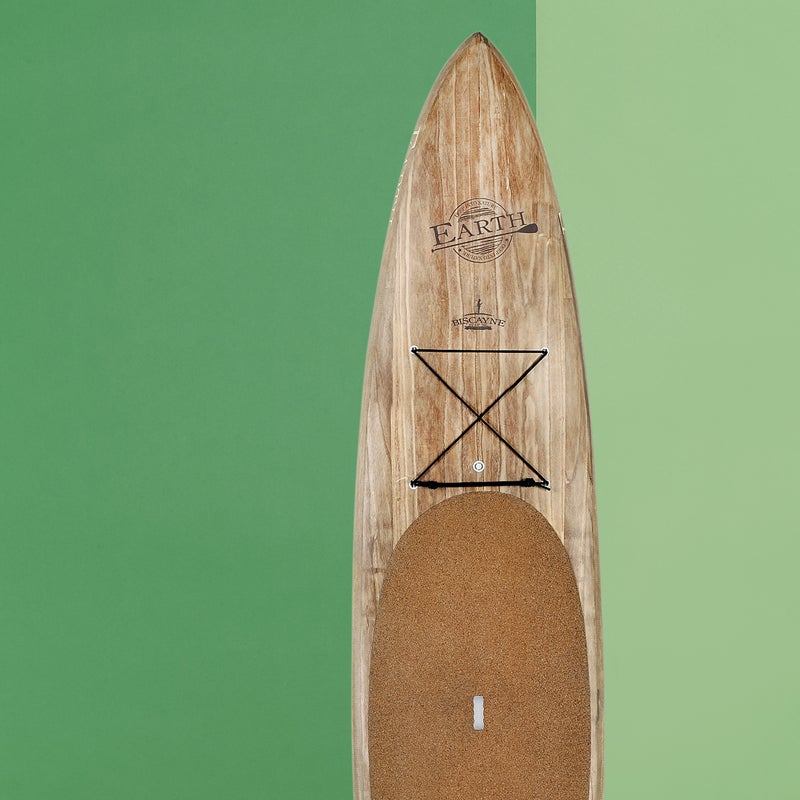 Best For: Day touring.
The Test: You could hang the Biscayne ($2,200) on your wall as art, but there’s purpose behind the beauty. To create a more eco-friendly board, Earth SUP tweaked the usual foam and fiberglass sandwich construction by adding fast-growing paulownia wood covered with flax-fiber cloth (plus some fiberglass). Instead of an EVA-foam deck pad on top there’s cork, which made the Biscayne the most comfortable SUP our feet have ever touched. At 28 pounds, the board is relatively lightweight, and it has a distinctively quick and slippery feel on the water. It turns beautifully, though beginners will find it a little tippy. If in doubt, choose the wider 29-inch model.
The Verdict: Sleek and sexy, in an earthy kinda way. 12'6"; supearth.com
Stability: 3
Glide: 4