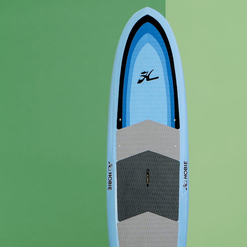 Best For: Newbies.
The Test: It wasn’t so long ago that all SUPs looked like oversize surfboards. The EVA-Lution ($1,199) carries on that legacy, but with good reason: the 31.5-inch-wide, five-inch-thick shape is ideal for tentative beginners and is as happy cruising on a glassy lake as it is surfing mellow waves. The EVA deck is padded nearly from nose to tail, providing lots of traction and a softer landing during wipeouts, as well as a suitable platform for yoga. Made from a foam core with bamboo, epoxy, and fiberglass-laminate overlays, the Hobie is supremely durable and, at just 25 pounds, impressively lightweight.
The Verdict: An affordable all-arounder and a perfect first SUP. 11'; hobie.com
Stability: 4
Glide: 3