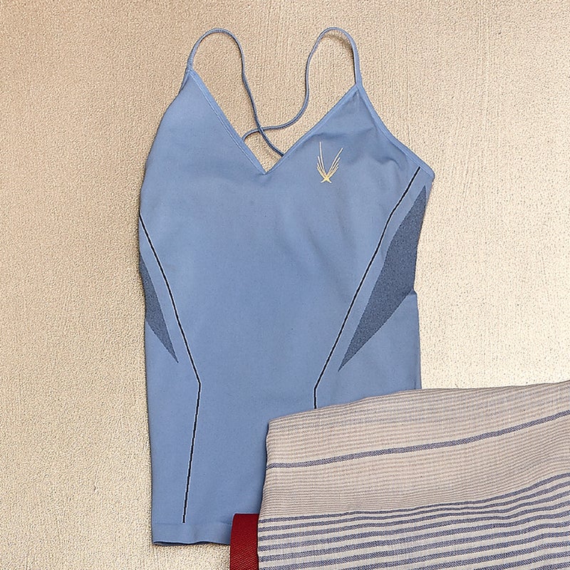 This top ($130) was designed with floor exercises in mind. No seams, clasps, or tags means no painful wear spots during crunch sets. Stylized mesh panels add ventilation without screaming “athletic wear.” lucashugh.com