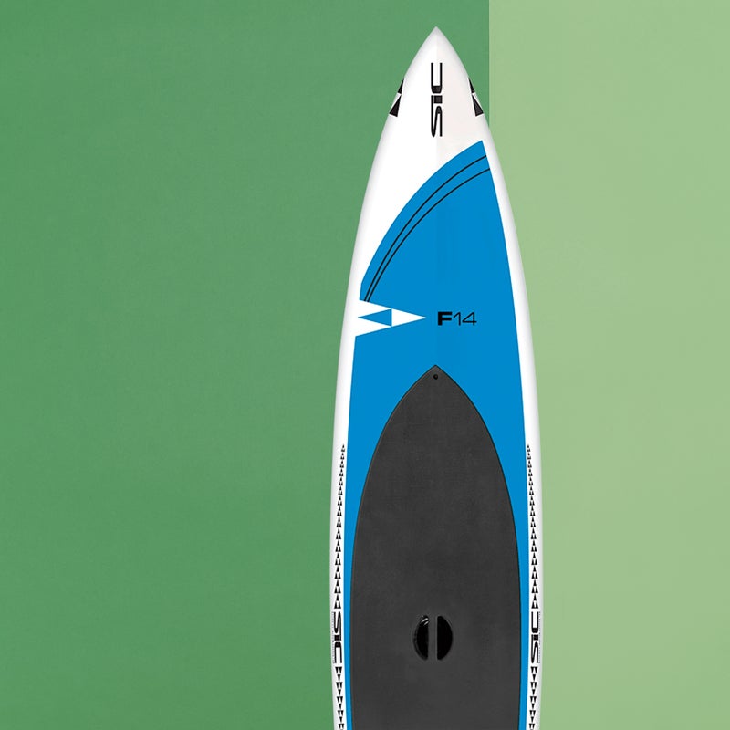 Best For: Sprinting comfortably.
The Test: This board borrows the superfast rocker shape of last year’s SIC Bullet 14 V.2 SCC—a svelte racer and the 2014 Gear of the Year winner—but boosts width to a nicely confidence--inspiring 30 inches and thickness to just over six inches to create a SUP that’s exceedingly user-friendly without sacrificing acceleration and glide. While it's perfect for day touring and fitness paddling, the F-14 ($2,399) is also a good choice for downwind runs. If you want to paddle fast but you’re not a racer (yet), this is your board.
The Verdict: An almost flawless SUP—and priced as such. 14'; sicmaui.com
Stability: 5
Glide: 4