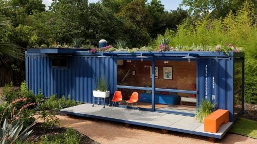 San Antonio's Poteet Architects made this structure from a recycled royal blue container. The space opens to its surrounding with sliding-glass doors and floor-to-ceiling windows. A green roof provides insulation and generous overhangs provide patio shade, while an interior clad in bamboo plywood breeds an air of relaxation.