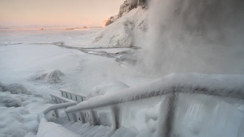 There’s no shortage of natural creativity in Iceland. To make this photo, I strapped on my crampons and braved the stairs. Spray from the waterfall not only helped me capture a scene right out of Frozen but also coated me with ice. The key to success? I kept moving, using my wipe cloth repeatedly on the Moment 18mm wide-angle lens. Pictured: Seljalandsfoss Waterfall.