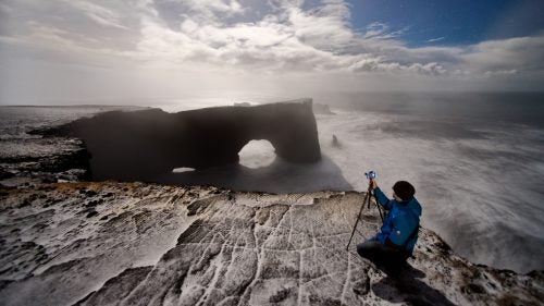 At night, everything deceives you. Looking across at this arch, it seems small. Don’t be fooled. That rock is 400 feet high and has more than enough surface area to support two simultaneous football games. Pictured: Dyrholaey.