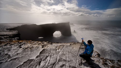 At night, everything deceives you. Looking across at this arch, it seems small. Don’t be fooled. That rock is 400 feet high and has more than enough surface area to support two simultaneous football games. Pictured: Dyrholaey.