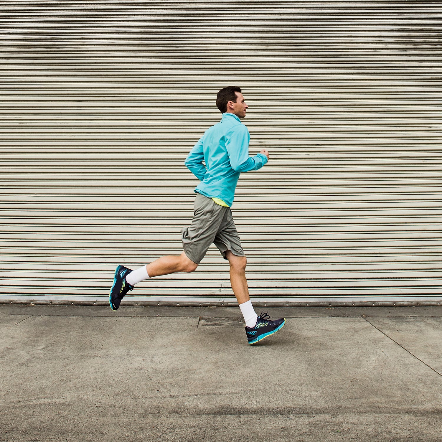 Caucasian man running on city street