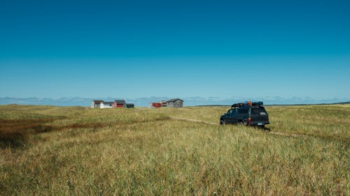 We saw these houses as little specks out on the beach as we drove north from Gros Morne National Park in Newfoundland. It didn’t look as though many people drove out that way since there was no marked road. We decided to pull off and see if we’d be able to drive out to the collection of fishing shacks. We ended up with an epic view of the houses as well as the south-facing landscape of Western Brook Pond, a landlocked fjord.