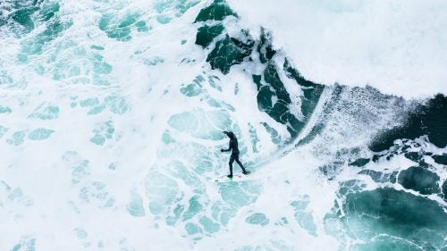 I'm always looking for new ways to photograph surfing, and lately that's meant hanging out of a helicopter looking straight down on the subject. This is Peter Devries bottom-turning on a wave near Tofino.