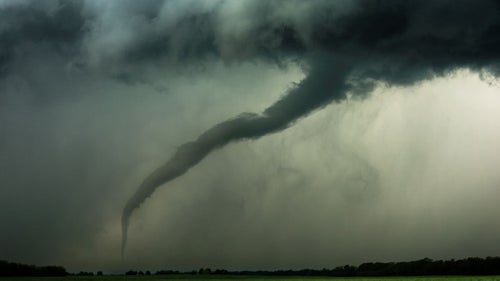 This tornado appeared suddenly over an empty field, just a few hundred yards away—we were only able to watch it for less than a minute before we had to jump back in the van and take off.