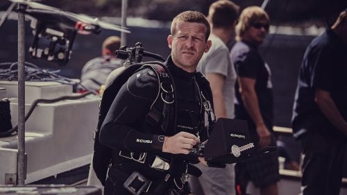 Casagrande prepares to dive near Guadalupe Island, Mexico. He never planned to become a cinematographer, he says, he just wanted to study sharks. He realized after working as a research cameraman that he preferred spending time with the animals in the water instead of analyzing data.