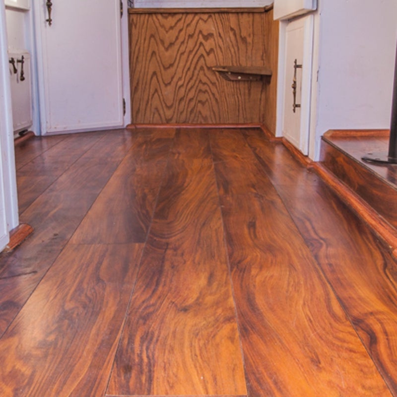 Yes, my camper has a real wood floor. First, it looks great. Second, it makes cleanup a breeze. And it was surprisingly easy to install.