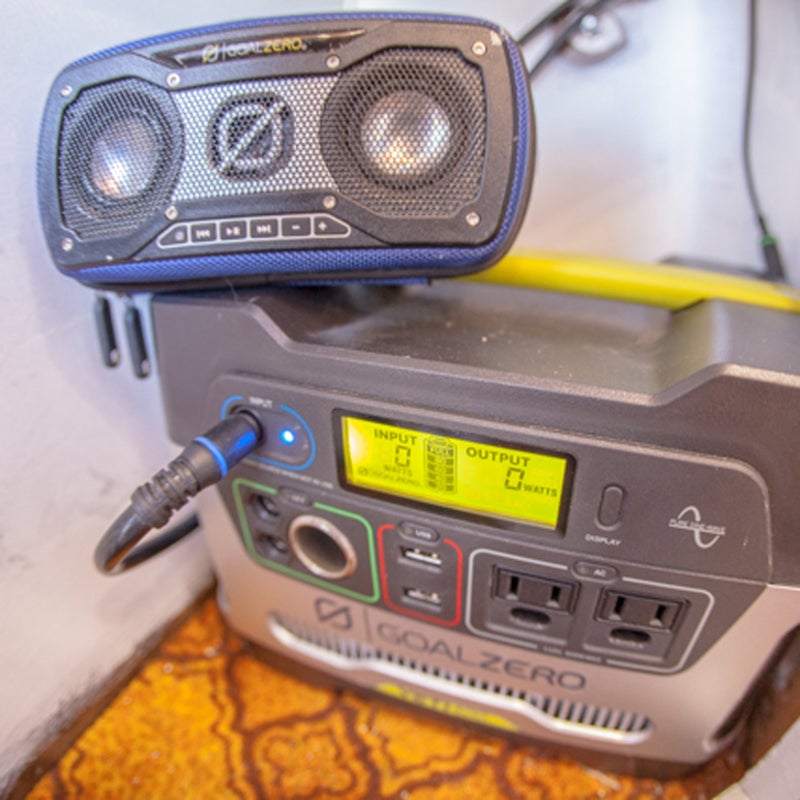 The Goal Zero Yeti 400 solar generator powers the camper. It stores the energy from the two 90-watt panels, and keeps the LEDs, fridge, heater, and speakers powered up.