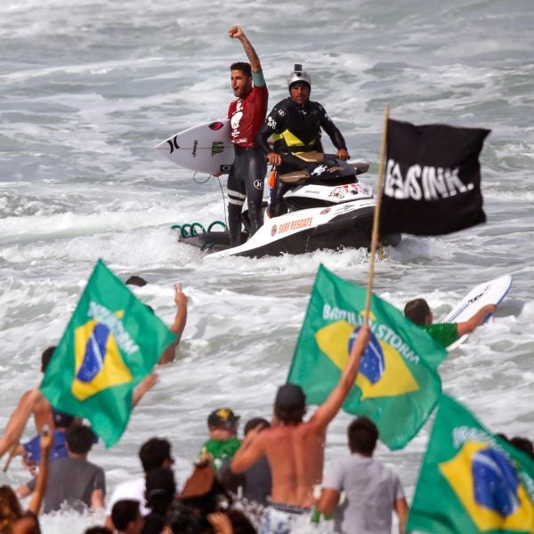Brazil's Filipe Toledo celebrates after winning the World Surf League (WSL) Rio Pro championship in Rio de Janeiro, Brazil, Sunday, May 17, 2015. Toledo defeated Australia's Bede Durbidge and won the championship. (AP Photo/Felipe Dana)