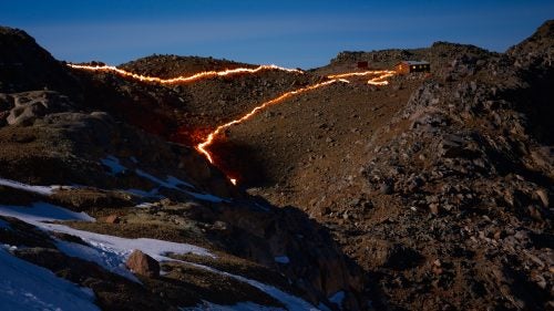 A wider view of Norfolk’s residence, the Austrian Hut. This portion of the glacier has receded 935 feet since 1963. The crack between the upper and lower portions of the glacier, depicted by the two fire lines, has also grown.