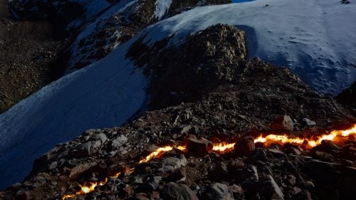 The crack of dirt, seen in the middle of the frame, has extended nearly the entirety of the glacier’s width in recent years. The lower half is no longer fed by the top and will likely be the next section to melt.