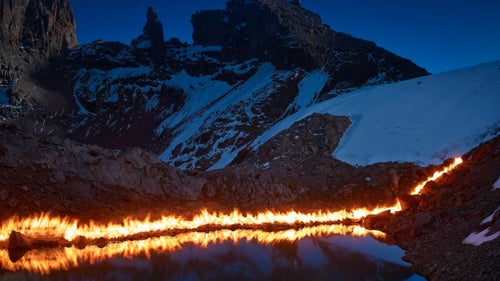 In 1947, the year marked by this fire line, the water was 50 feet higher and the back of the pond was a small cliff of ice. Lewis Glacier is one of the most surveyed tropical glaciers in the world and scientists have been studying it closely for decades. The abundance of information made it a perfect subject for Norfolk and this project.