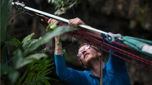 Hudnut’s attention to detail borders on the obsessive compulsive. Each line is different, and while some can take less than an hour to rig, others can take days. Here, Peter’s using a five-to-one pulley system to tension the line tight enough to support his weight.
