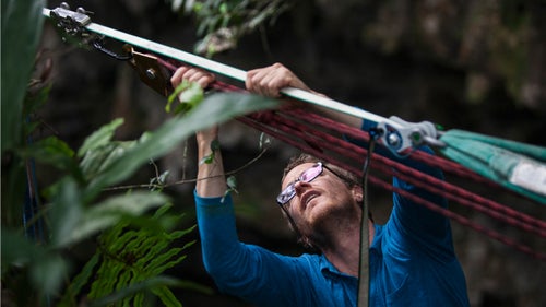 Hudnut’s attention to detail borders on the obsessive compulsive. Each line is different, and while some can take less than an hour to rig, others can take days. Here, Peter’s using a five-to-one pulley system to tension the line tight enough to support his weight.