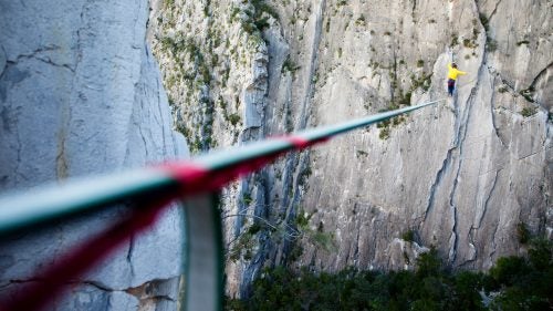 A modern highline is made from a piece of one-inch-wide flat polyester webbing, usually between 200 and 300 feet long. Taped underneath is a thin dyneema cord. Were the main line to fail, this redundancy would prevent a catastrophic fall.
Getting the line to the other side of the feature, whether it be a cave, canyon, or rock formation, is an arduous task. Often we just throw a rope as far as we can from the first anchor and bushwhack our way to the other side and climb up. Today, highliners are starting to use drones and even high-tech bows to get lines across.