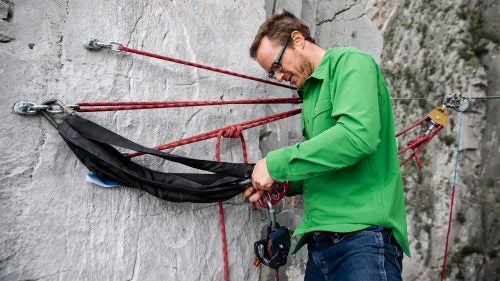 Highline anchors can be rigged in many different ways, but Hudnut prefers the method he learned from his mentor, Terry Acomb, who has been developing highline systems since the late ‘90s. Hudnut drills multiple 5.5-inch x 0.5-inch bolts into the hard limestone and equalizes the system with a sliding “X” of static 11-millimeter cordelette.