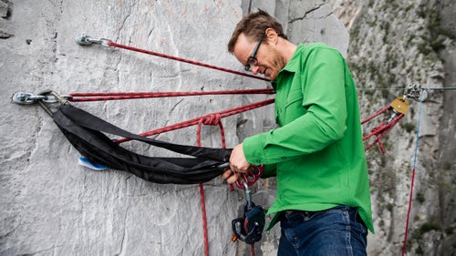 Highline anchors can be rigged in many different ways, but Hudnut prefers the method he learned from his mentor, Terry Acomb, who has been developing highline systems since the late ‘90s. Hudnut drills multiple 5.5-inch x 0.5-inch bolts into the hard limestone and equalizes the system with a sliding “X” of static 11-millimeter cordelette.