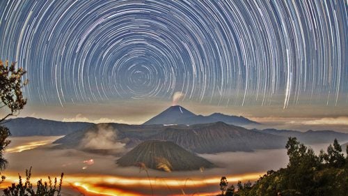 Malaysian photographer Hui Chieh Teoh created this long exposure image of star trails around the south celestial pole above the steaming volcanoes of Bromo Tengger Semeru National Park of East Java, Indonesia, in June 2014. It won fourth place in the Against the Lights category.