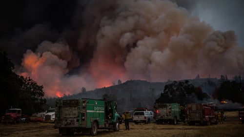 Firefighters watch the Rocky Fire advance in Lake County, California, on July 30.