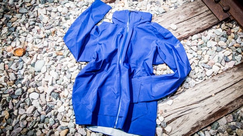 I look forward to bike commuting in the fall. Sure, it’s a little chillier on the way to and from work, but the colder temps are a good excuse to upgrade your kit. We’ve gathered some of our favorite pieces—plus some fun accessories—designed to keep you warm, safe, and happy in cold weather.
Arc’teryx Interstate Jacket ($449)
Arc’teryx is known for making bomber, technical jackets ideal for braving climbs in the Canadian Rockies. Bike commuting is a good deal tamer, which is why the company dialed the specs back on this urban piece.
Instead of Gore-Tex Pro, Arc’teryx chose Gore-Tex fabric with C-Knit-backer technology, which is still tough as nails and waterproof in a downpour, but softer next to skin. And instead of a giant, helmet-compatible flap, the hood stows neatly in the collar. You still get a rig that will take a beating, but it’ll also blends in nicely on city streets.