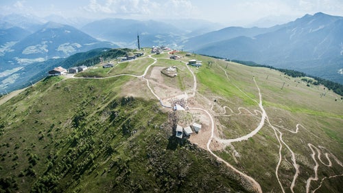 Architect Hadid said in a press release that the concept behind the design is “the idea that visitors can descend within the mountain to explore its caverns and grottos, before emerging through the mountain wall on the other side, out onto the terrace overhanging the valley far below with spectacular, panoramic views.”