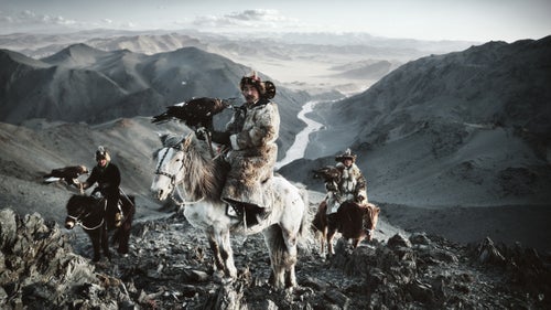 According to photographer Jimmy Nelson, the Before They Pass Away project began nearly 30 years ago when he began walking from one side of Tibet to the other. That’s when he set it upon himself to document the last of the world’s ancient tribes and peoples with his 50-year-old 4x5 film camera. Nelson then spent the next four years traveling across the world to photograph 31 tribes, chosen for their geographical, traditional, and aesthetic importance. He spent two weeks with each photographing and learning a little about their traditions, mannerisms, and beliefs.
Now, each community's images are captured between the covers of his new photography book Before They Pass Away. “My dream had always been to preserve our world’s tribes through my photography,” writes Nelson. “Not to stop change from happening—because I know I can’t—but to create a visual document reminding us, and the generations after us, of the beauty of pure and honest living.” Here, we preview of Nelson’s book and some of the people he encountered.
Photo: The Kazakhs of the westernmost province of Bayan-Ölgii, Mongolia, are a Turkic people originating from the northern parts of Central Asia and can trace their roots to the 15th century. Most Kazakhs in this remote, mountainous region are dependent on domestic animals for their livelihood and practice the ancient tradition of hunting rabbits, marmots, foxes, and wolves on horseback with the help of trained golden eagles.
