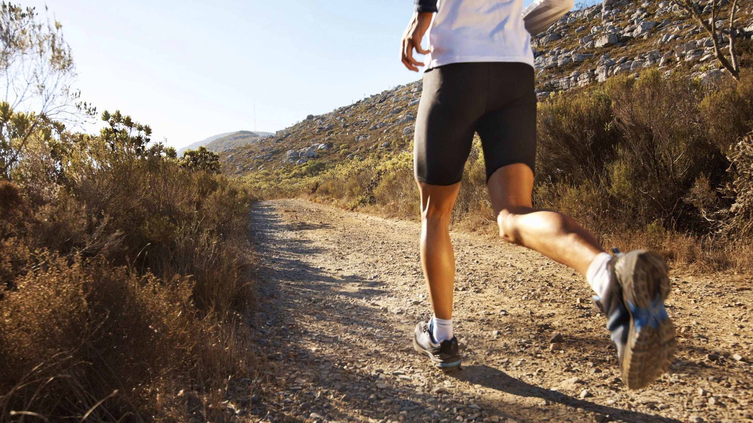 trail runners on pavement