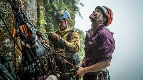 In the spring of 2015, National Geographic Resident Explorer and my good friend, Mike Libecki, called me and said he had an idea to climb a remote tower in the jungle of Ua Pou Island, French Polynesia. “There will be moments that you wish you never came,” he said. Oddly enough, that was exactly what my filming partner Keith Ladzinski and I wanted to hear, as the best expeditions usually hold a good bit of struggle. Plus, Libecki has a knack for finding the most unexplored and uncharted climbing locations on the planet and being the first to summit.
For this expedition, Libecki enlisted Angie Payne to be his climbing partner. Payne, after a successful trip to Greenland with Libecki in 2012, made the mistake of telling Libecki she would go on any “crackpot” mission he ever conjured up. The only issue was that Payne had never climbed a big wall before. But Libecki wasn’t looking for climbers as much as he was looking for people that could take the suffering. In that way, we were all a perfect fit.
We set out on the 21-day mission this March, and after 16 days of debris-filled climbing in horrible conditions, Libecki led us to the summit of Poumaka in a tropical storm.
Photo: Libecki and Payne with unknown pitches and struggle above them.