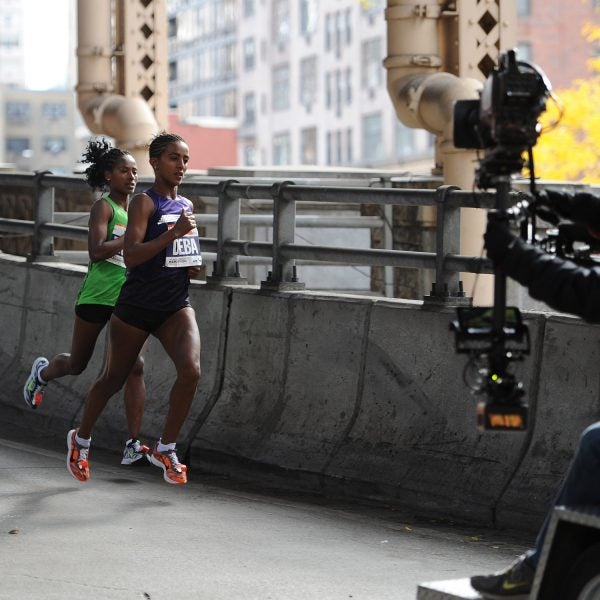 Two lead pack runners folioed by a television camera make their way across the Ed Koch Queensboro Bridge while participating in the ING New York City Marathon in New York, NY, on November 3, 2013. (Photo by Anthony Behar/Sipa USA)