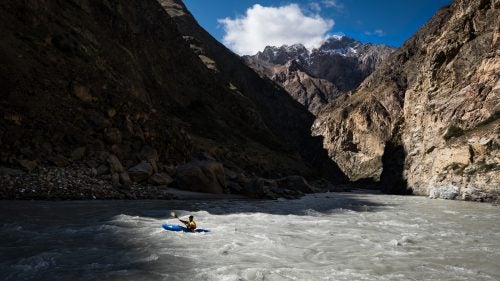 Hey all you paddlers and water junkies: Imagine a river with steep, big water rapids like the Stikine in British Columbia running through deep-walled canyons like the Grand Canyon in Arizona. It’s understandably hard to visualize, but these pictures of Kyrgyzstan’s Sary-Jaz River should help. The river begins at the Inichelk Glacier—one of the largest non-polar icecaps—and descends through inescapable rapids and steep canyons that narrow to nearly one meter across in the tightest sections. That’s a description to send most people running. For others, like photographer and paddler Erik Boomer plus a team of proven international kayakers, it sounds like an invitation. Here, Boomer shares a few of his favorite images from the crew’s September expedition down one of Asia’s most difficult rivers.
Photo: Days felt short in the canyon as the sun would quickly pass and jump from one wall to the other. Here, paddler Jared Meehan flows into the shade.