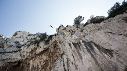 On the rocky shores of Cassis in southern France, the whole village has gathered and the excitement rises as Lionel Franc prepares to dive from 98 feet—his highest ever. After a few minutes of deep concentration, Franc steps forward, raises his arms and jumps into the void. Three seconds later, he enters the water at a speed of 60mph. His trainer and two lifeguards move in to make sure he is safe. He quickly emerges making the OK signal with his hands. At 45, Franc is one of the few cliff-divers in the world to enter the water head-first. Known around town as Loulou, Franc began diving as a boy and was trained by Jean-Michel Beaujon, who was a student of Father Simon, a famous cliff diver with the nickname “the flying-priest.” Franc is a father of three and follows an intense physical training plan, dives year round, and, by all accounts, has dedicated life to performing dives from such heights. Over the last year, French photographer Brice Portolano spent time with Franc in the calanques—steep-walled inlets of limestone in southern France—and returned with a collection of incredible images. Here, Portolano shares a few of his favorites and a window into the cliff diver’s world.