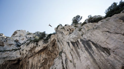 On the rocky shores of Cassis in southern France, the whole village has gathered and the excitement rises as Lionel Franc prepares to dive from 98 feet—his highest ever. After a few minutes of deep concentration, Franc steps forward, raises his arms and jumps into the void. Three seconds later, he enters the water at a speed of 60mph. His trainer and two lifeguards move in to make sure he is safe. He quickly emerges making the OK signal with his hands. At 45, Franc is one of the few cliff-divers in the world to enter the water head-first. Known around town as Loulou, Franc began diving as a boy and was trained by Jean-Michel Beaujon, who was a student of Father Simon, a famous cliff diver with the nickname “the flying-priest.” Franc is a father of three and follows an intense physical training plan, dives year round, and, by all accounts, has dedicated life to performing dives from such heights. Over the last year, French photographer Brice Portolano spent time with Franc in the calanques—steep-walled inlets of limestone in southern France—and returned with a collection of incredible images. Here, Portolano shares a few of his favorites and a window into the cliff diver’s world.