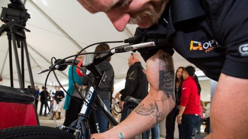 Optum pro cyclist Brad Huff shows off his tattoo, a tradition inside the peloton among riders committed to competing clean.