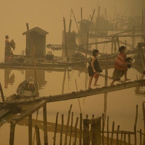 Members of the indigenous community live at the riverbanks in Kapuas river where the air is engulfed with thick haze at Sei Ahass village, Kapuas district, Central Kalimantan province on Borneo island, Indonesia.These fires are a threat to the health of millions. Smoke from landscape fires kills an estimated 110,000 people every year across Southeast Asia, mostly as a result of heart and lung problems, and weakening newborn babies.
