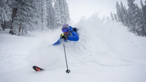 Outside contributing editor Nick Heil gets buried in deep snow near the top of Ski Santa Fe. I told Heil to ski fast and come right at me so we could get a sense for how deep the snow really was.