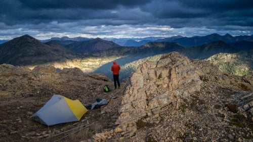 Squeezing three guys into a one-and-a-half-man tent wasn't the most enjoyable part of the journey. But it sure helped them stay warm during whiteouts on ridges, a common autumn scene in the Northern Rockies. During dry nights—like this one on Montana's Swan Crest—the runners spread out to sleep alone.